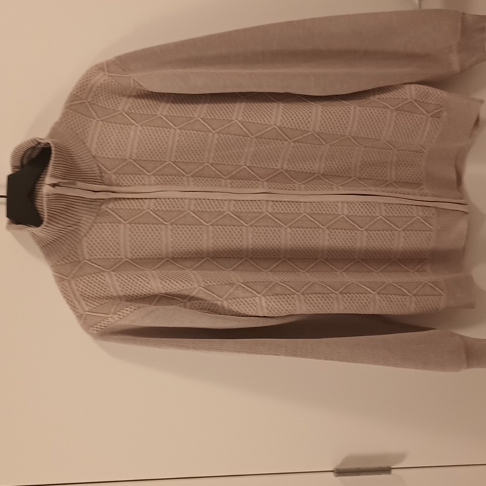 A Vertical Sport cream  zip up sweater. Size medium.